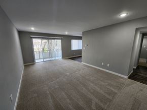 Palo Alto apartment for rent - a empty living room with a large window and gray walls