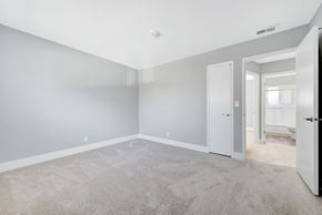 Sunnyvale apartment for rent - A spacious room with grey walls and carpeted floor.