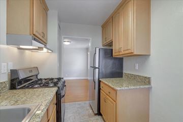 Menlo Park apartment for rent - a kitchen with granite counter tops and a black refrigerator