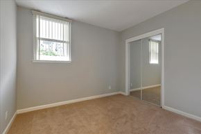 San Mateo apartment for rent - A room with a carpeted floor and a sliding glass door.