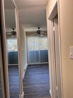 Burlingame apartment for rent - a spiral staircase in a house with two ceiling fans