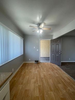 Mountain View apartment for rent - a living room with a wood floor and a ceiling fan