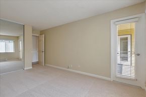 Redwood City apartment for rent - a spacious living room with a door to the bathroom