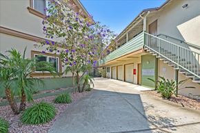 Menlo Park apartment for rent - a sidewalk in front of a building with a staircase