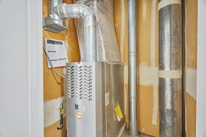 Mountain View apartment for rent - A wall with pipes and a ventilation system.