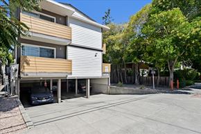 Menlo Park apartment for rent - an apartment building with a car parked in a driveway