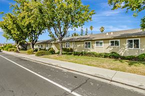 Santa Clara apartment for rent - A row of houses with trees in front.