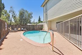 Redwood City apartment for rent - A small pool with a fence around it.