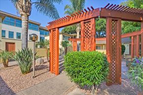 Menlo Park apartment for rent - a gazebo with a bush in front of a house