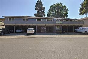 Menlo Park apartment for rent - A parking lot in front of a building with a sign that says