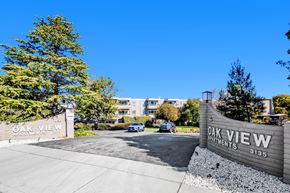 San Mateo apartment for rent - The image shows the entrance to the Oak View Apartments with a clear blue sky in the background.