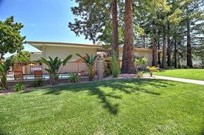 Menlo Park apartment for rent - A house with a white roof and a green lawn in front.