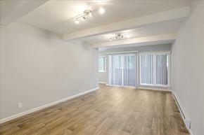 Redwood City apartment for rent - A room with wooden flooring and a window with blinds.