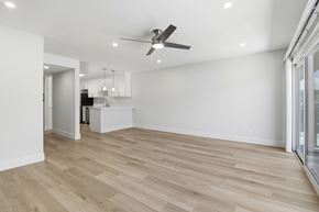 San Mateo apartment for rent - A spacious room with a ceiling fan and lighting fixtures.