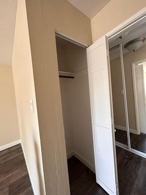 Burlingame apartment for rent - a bedroom with a closet and a mirrored closet door