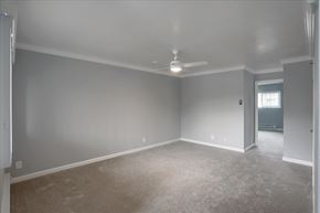 Mountain View apartment for rent - A room with a carpeted floor and a ceiling fan.