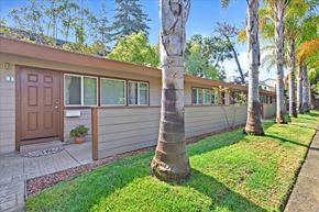 Menlo Park apartment for rent - the front of a house with a yard and palm trees