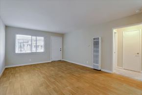 Mountain View apartment for rent - A room with wooden flooring and two doors.
