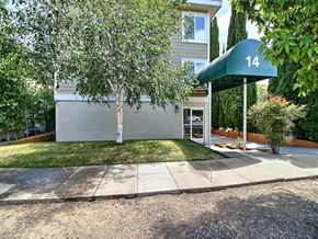 Burlingame apartment for rent - the front of a house with a sidewalk and a tree