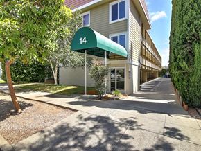 Burlingame apartment for rent - a building with a green canopy in front of it