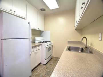 Menlo Park apartment for rent - a kitchen with white appliances and a sink and a refrigerator