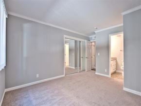 Menlo Park apartment for rent - A spacious room with grey walls and a carpeted floor.