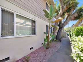 Mountain View apartment for rent - A house with a small garden in front.