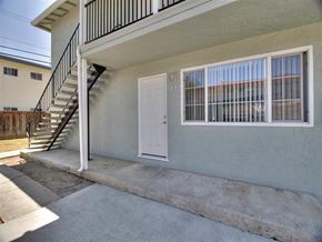 San Jose apartment for rent - the front door of an apartment building with a staircase