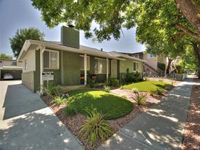 San Jose apartment for rent - a small green house with a sidewalk and lawn