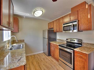San Jose apartment for rent - a kitchen with stainless steel appliances and granite counter tops