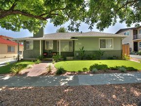 San Jose apartment for rent - a green house with a yard and a sidewalk