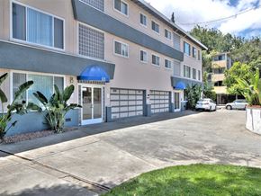 San Mateo apartment for rent - a building with a driveway and a parking lot