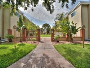 Sunnyvale apartment for rent - A pathway leads to a gate in a landscaped yard.