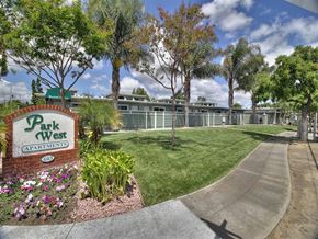 Sunnyvale apartment for rent - A sign for Park West Apartments is in front of a building and trees.