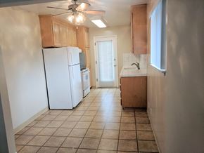 Palo Alto apartment for rent - an empty kitchen with a refrigerator and a sink