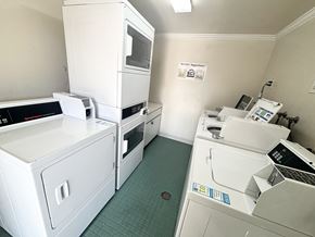 Palo Alto apartment for rent - A clean, white-walled commercial kitchen with green floor tiles.