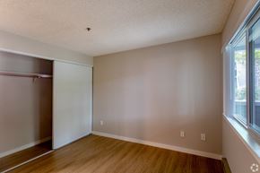 Palo Alto apartment for rent - an empty bedroom with a closet and a window