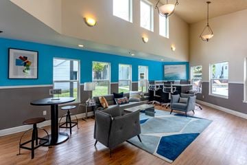Palo Alto apartment for rent - a living room with couches chairs and tables and a piano