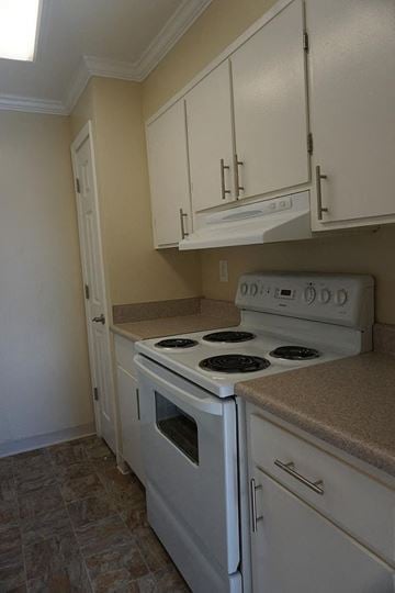 Redwood City apartment for rent - a kitchen with white appliances and white cabinets