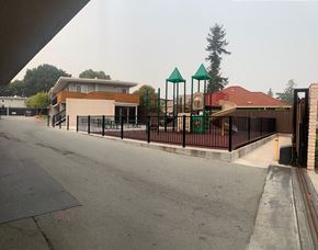 San Mateo apartment for rent - a playground at a school with a black fence
