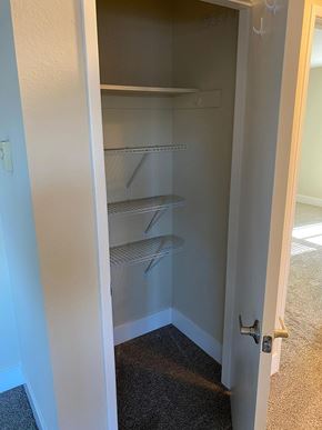 Sunnyvale apartment for rent - Empty white pantry with a white door.