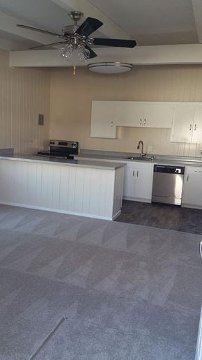 Mountain View apartment for rent - A kitchen with a ceiling fan and a counter.
