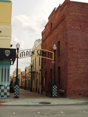 San Mateo apartment for rent - A street view of Main Street with a brick building on the right.