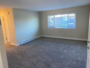 Sunnyvale apartment for rent - A room with a carpeted floor and a window with blinds.