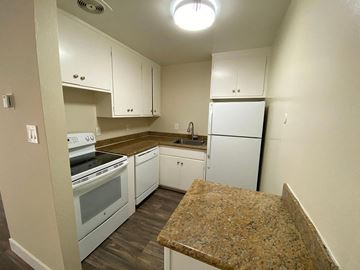 San Mateo apartment for rent - a kitchen with white appliances and granite counter tops