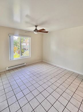 Sunnyvale apartment for rent - an empty living room with a ceiling fan and tiled floor