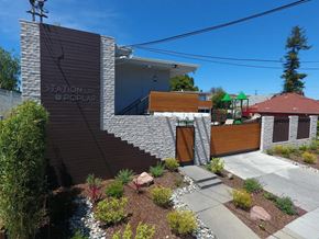 San Mateo apartment for rent - a view of the front of a house with a staircase and a garden