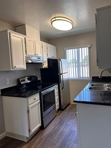 Burlingame apartment for rent - a kitchen with a stove refrigerator and sink