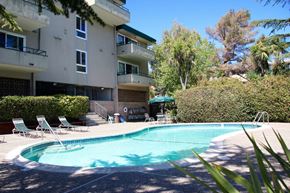 San Mateo apartment for rent - a swimming pool in front of an apartment building