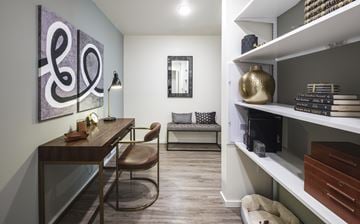 Mercer Island apartment for rent - A modern living room with a wooden table and a brown leather chair.